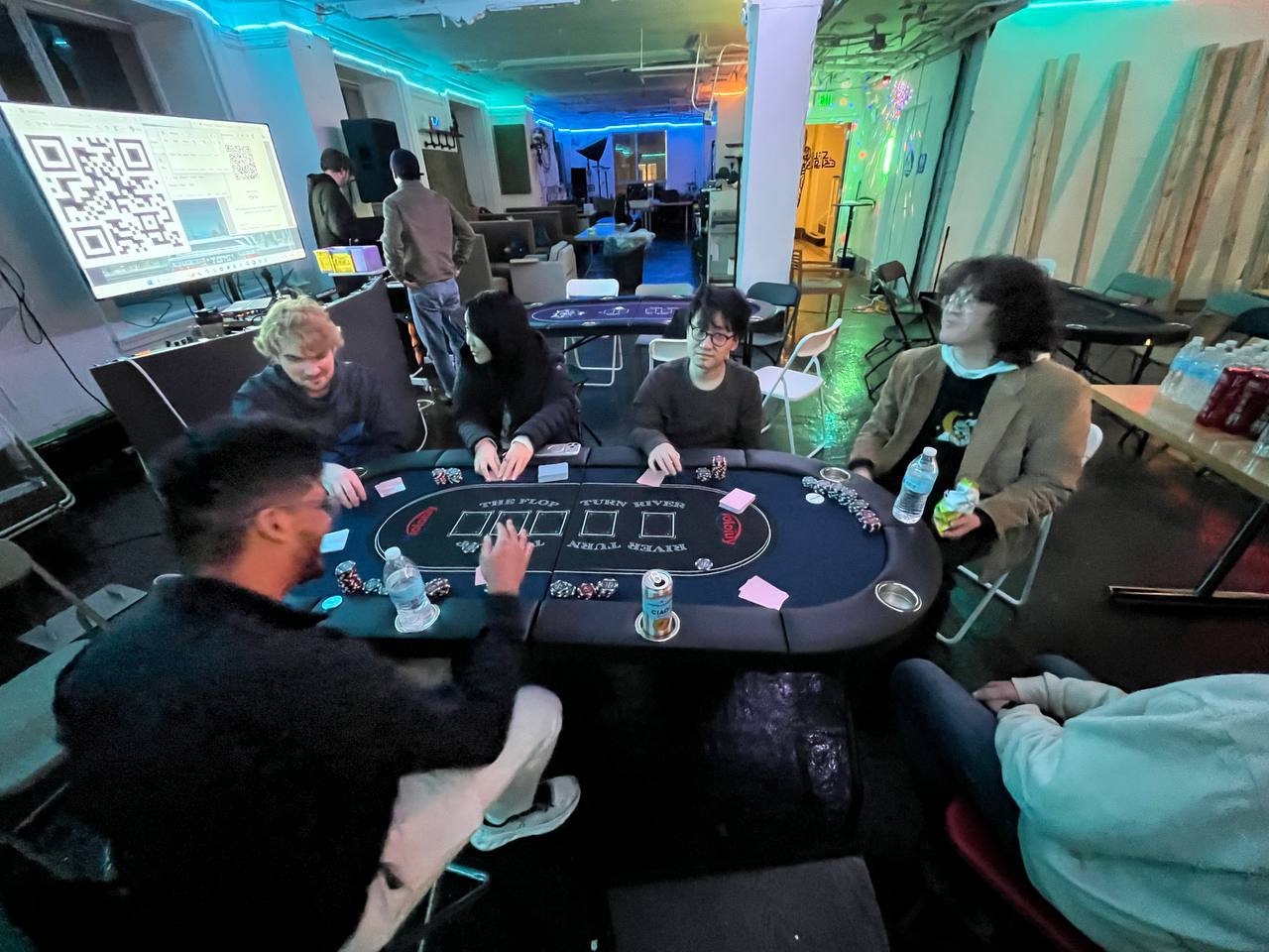 Poker night with neon lighting and a professional poker table