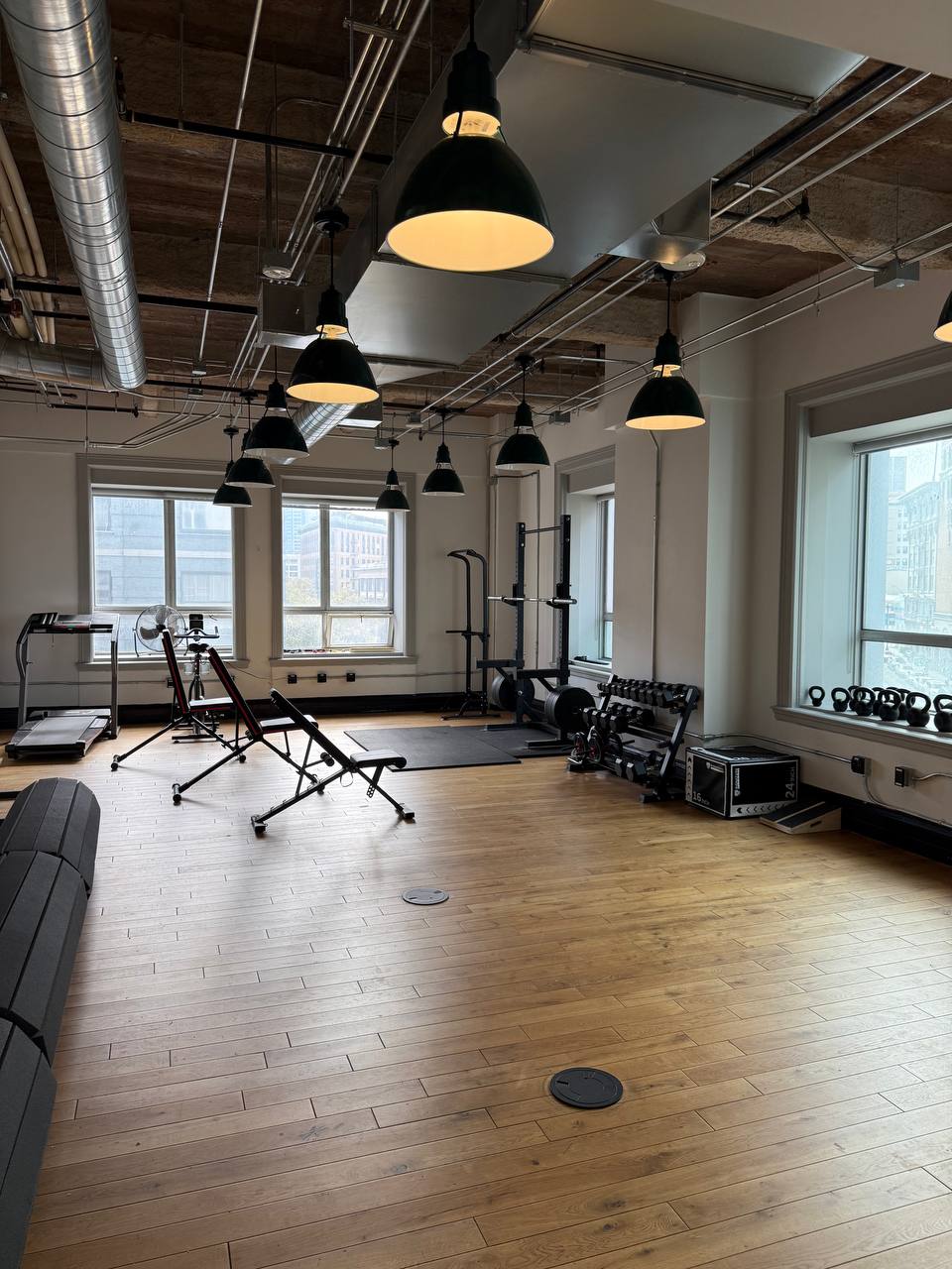 Wide shot of gym with treadmill and equipment
