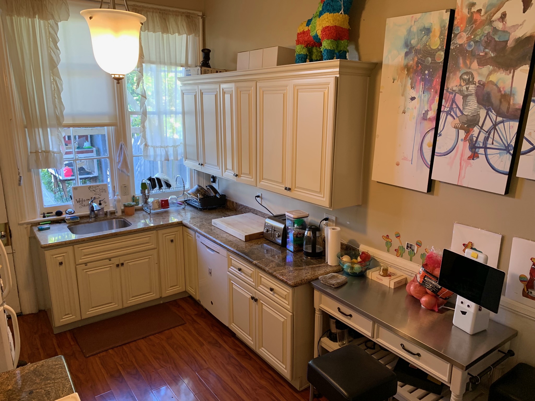 Kitchen with piñata and colorful artwork