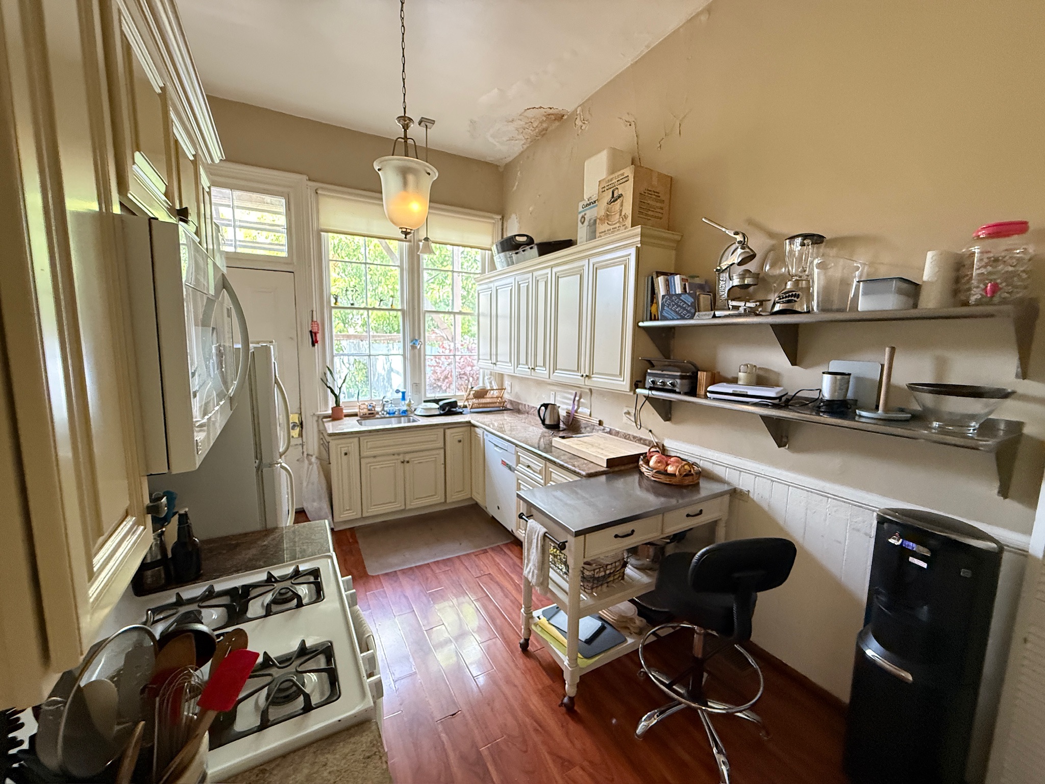 Kitchen with white cabinets and island