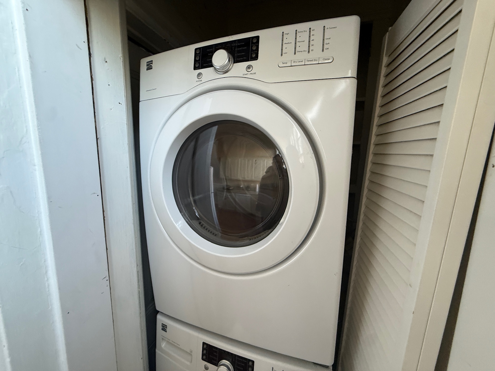 Stacked washer and dryer in closet
