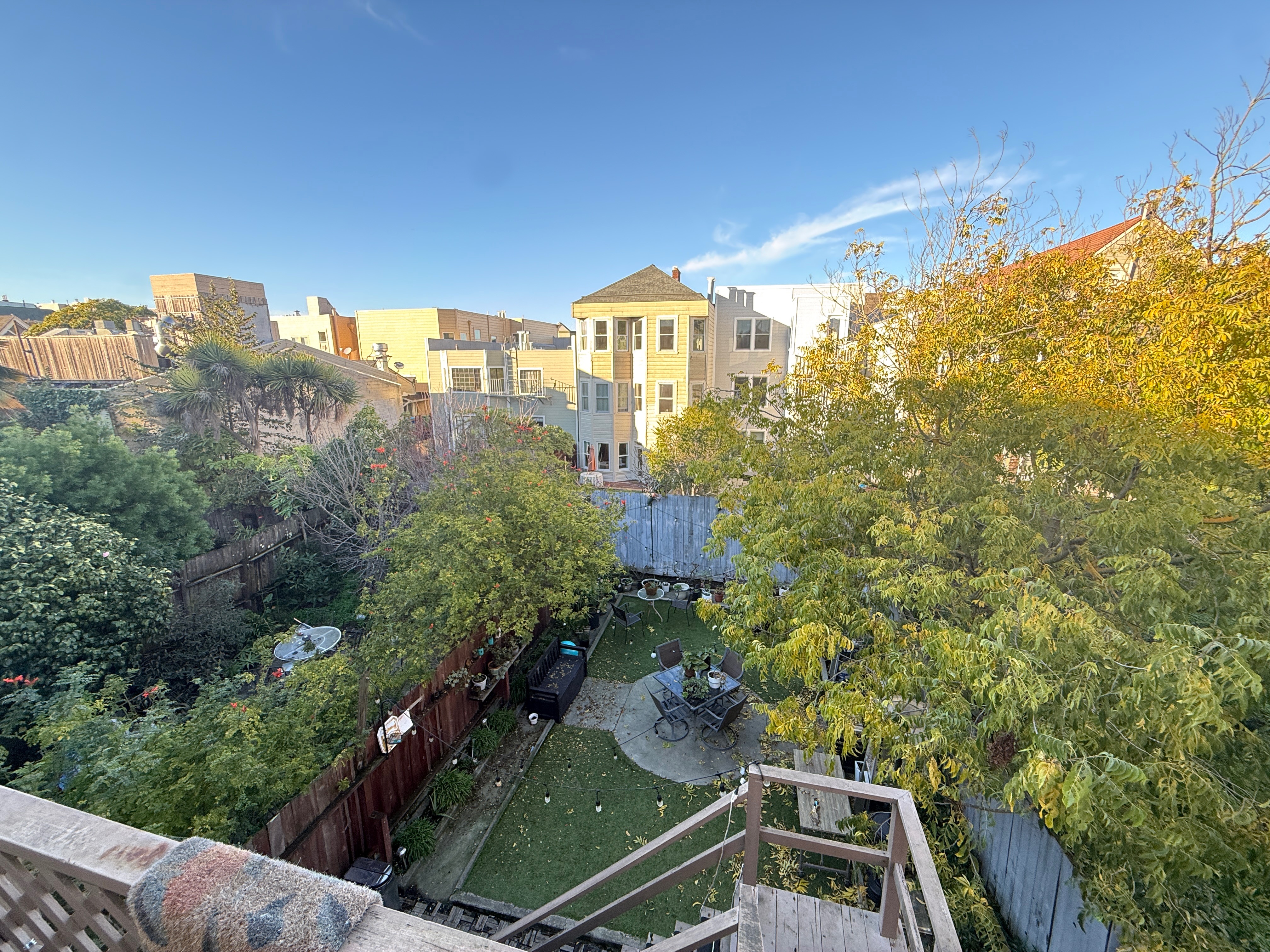 Aerial backyard view with seating and Victorian houses
