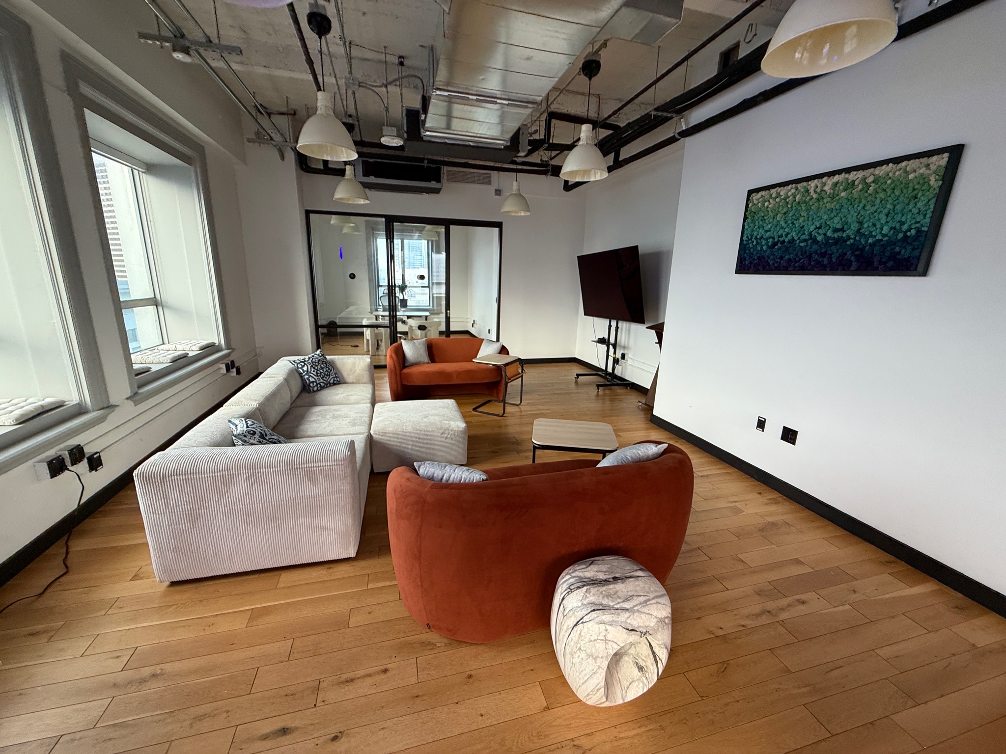 Modern lounge with comfortable seating and TV